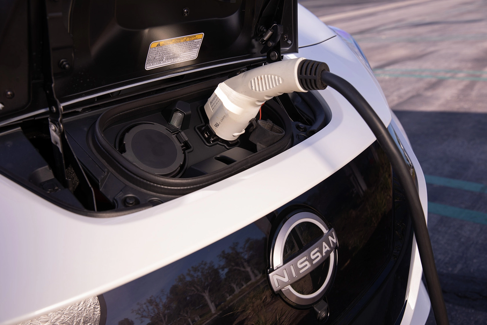 charging a nissan electric vehicle leaf 2023